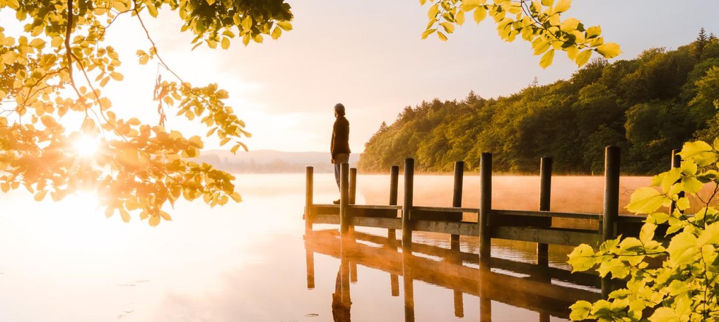 Man standing at the  Borre Sø in the sunset, Silkeborg, Denmark