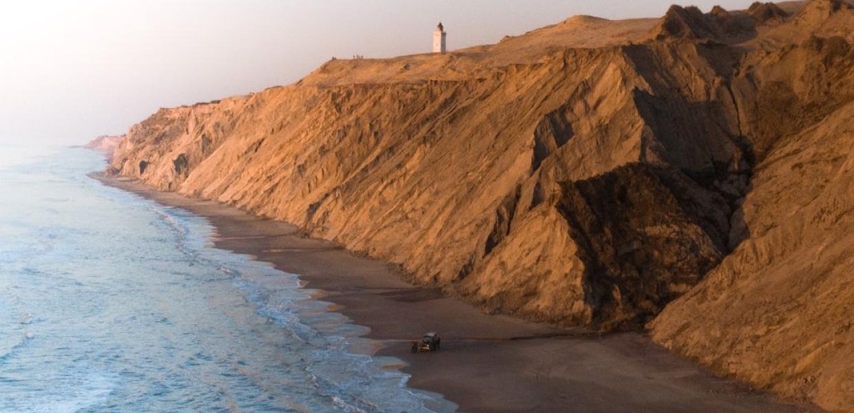 Rubjerg Knude Lighthouse view with cliffs and sea, North Jutland