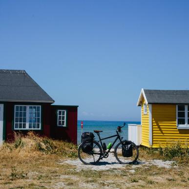 A stop by the beach cabins on Ærø while cycling the Baltic Sea Cycling Route in Denmark